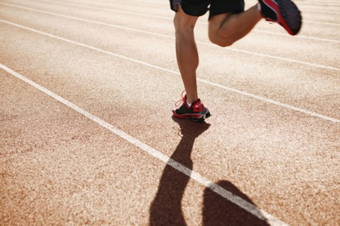 Male athlete running on a track