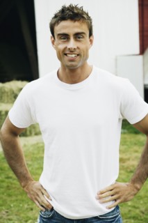 Man with hands on hips on farm