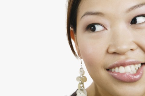 Close up of Asian woman biting lip