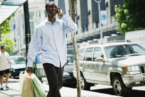 African man talking on cell phone