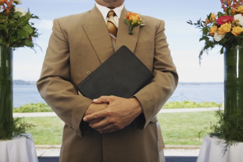 Hispanic man holding book