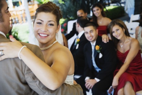 Hispanic bride dancing with father