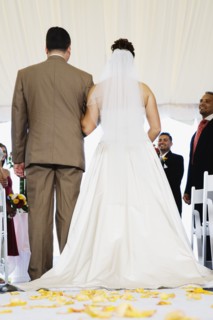 Bride being walked down aisle