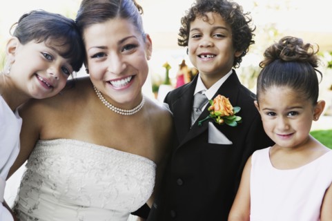 Bride and children hugging