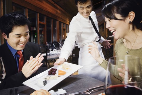 Asian couple eating at restaurant