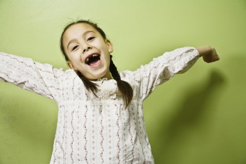 Asian girl with arms outstretched