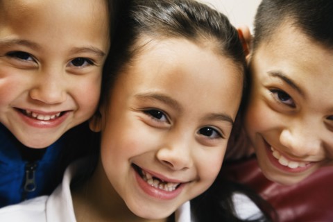 Close up of Asian siblings smiling