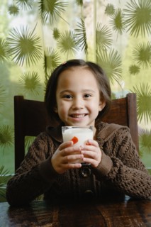 Asian girl drinking milk