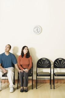 Multi-ethnic couple sitting in waiting area