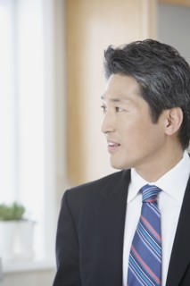 Asian businessman looking to side
