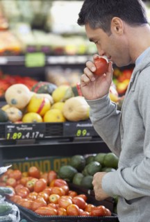 Hispanic man shopping for produce