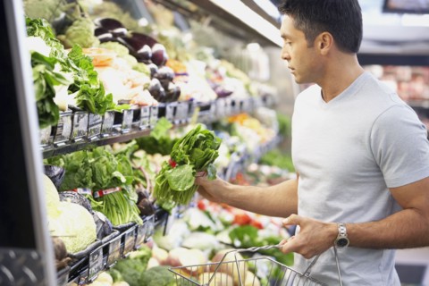 Hispanic man shopping for produce