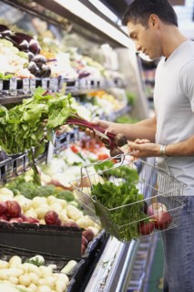 Hispanic man shopping for produce