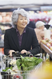 Senior Asian woman in grocery store