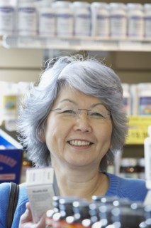 Senior Asian woman shopping for vitamins