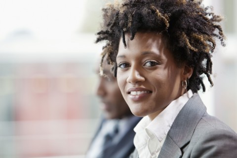 Mixed race businesswoman smiling