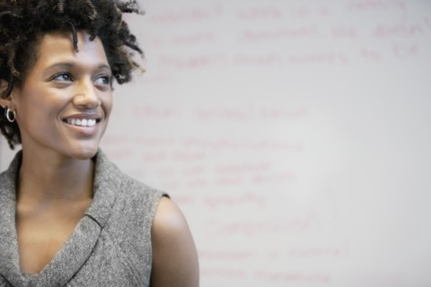 Smiling mixed race businesswoman