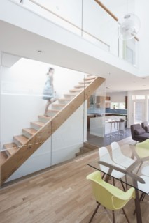 Mixed race girl walking up staircase