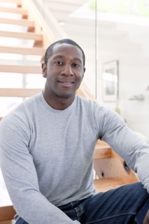 Black man sitting on stairs