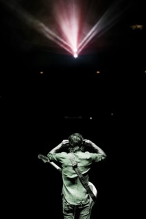 Rear view of musician standing onstage