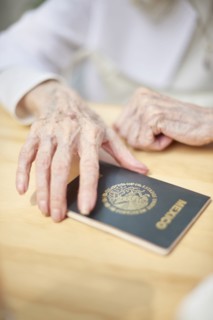 Older Caucasian woman holding Mexico passport