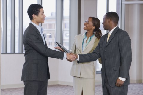 Multi-ethnic business people handshaking