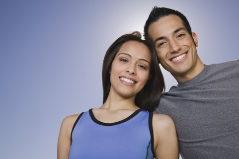 Confident Hispanic couple smiling