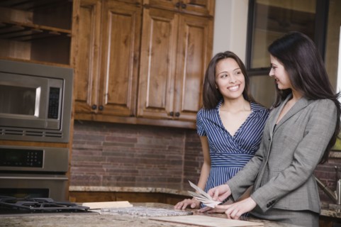 Hispanic woman working with interior designer