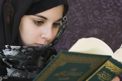 Middle Eastern teenager reading book