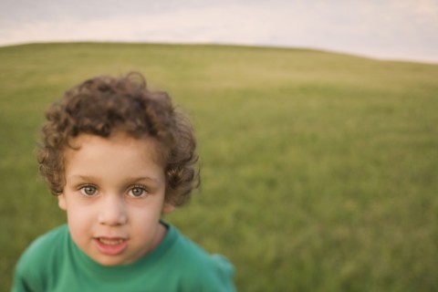 Mixed race boy in field