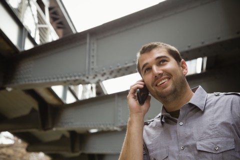 Hispanic man talking on cell phone