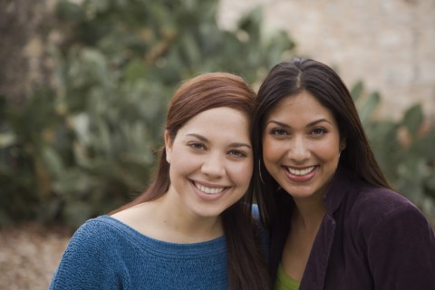 Woman smiling together