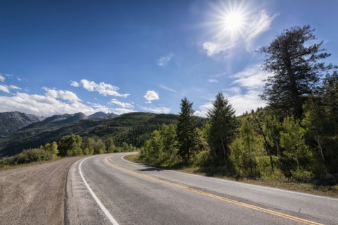 Curving two-lane road near mountains
