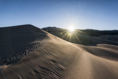 Sunbeams on sand dunes