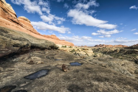 Clouds in blue sky over desert in Moab