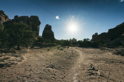 Sun in blue sky over desert