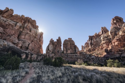 Sun in blue sky over desert