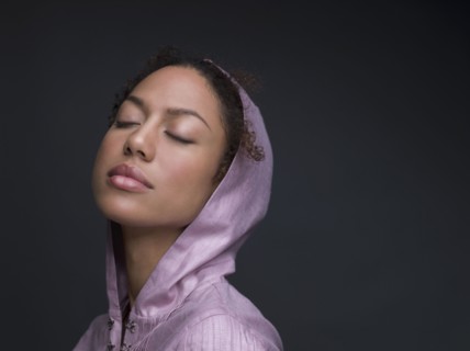 Mixed Race woman wearing hooded shirt