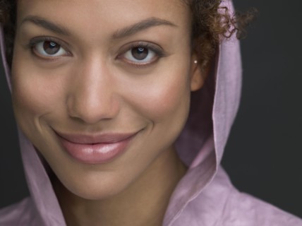 Mixed Race woman wearing hooded shirt