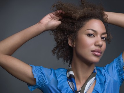 Mixed Race woman with hands in hair