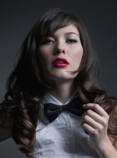 Mixed Race woman wearing bowtie