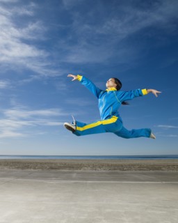 Asian woman jumping in air