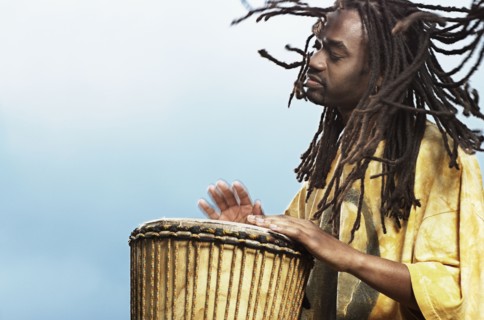 African man playing drum