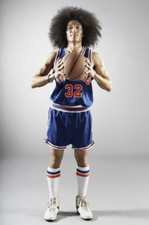 Mixed race basketball player holding basketball