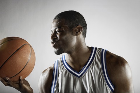 African basketball player holding basketball