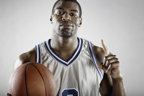 African basketball player holding basketball