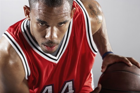 African basketball player holding basketball