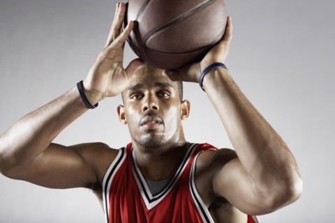 African basketball player shooting basketball