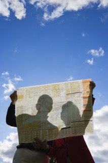 Couple looking at map outdoors