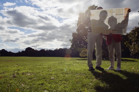 Couple looking at map outdoors